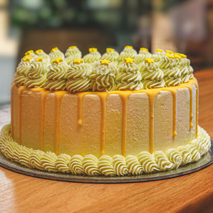 front view of celestial-inspired decorative details on a handcrafted green starry night ice cream cake.