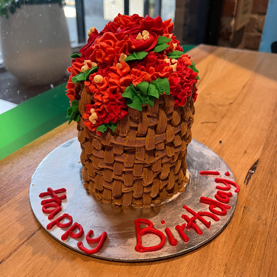 Full view of a tall basket of roses cake handcrafted in Adelaide using Ben & Jerry's ice cream, featuring elegant floral-inspired decorations.