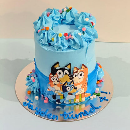 top view of the Tall Bluey Ice Cream Cake handcrafted in Adelaide with Ben & Jerry’s ice cream and colourful Bluey-inspired birthday decorations.