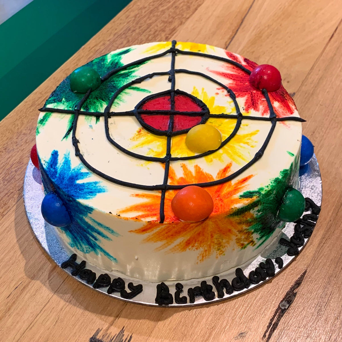 Full view of a Nerf-inspired target practice birthday cake handcrafted in Adelaide using Ben & Jerry's ice cream, featuring an action-themed design.