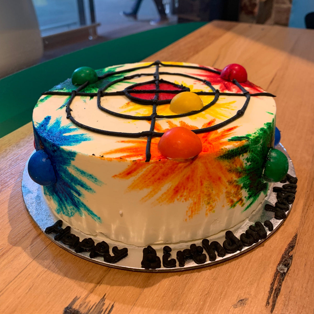 front view of a handcrafted Nerf-themed ice cream cake in Adelaide made using Ben & Jerry's ice cream, highlighting its target practice styling.