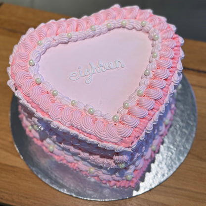 top view of a heart-shaped vintage cake made with Ben & Jerry's ice cream in Adelaide, showcasing its elegant Lambeth-inspired borders.