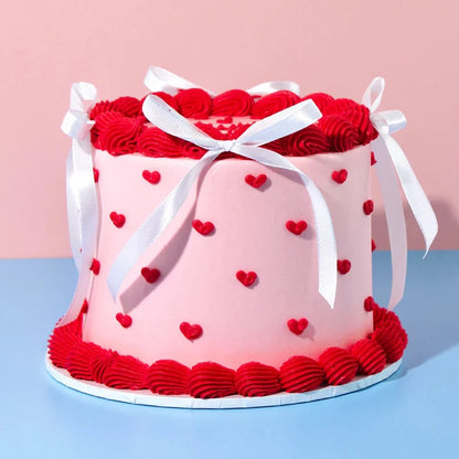 front view of the heart-inspired decorations on a romantic Valentine's Day cake handcrafted in Adelaide.