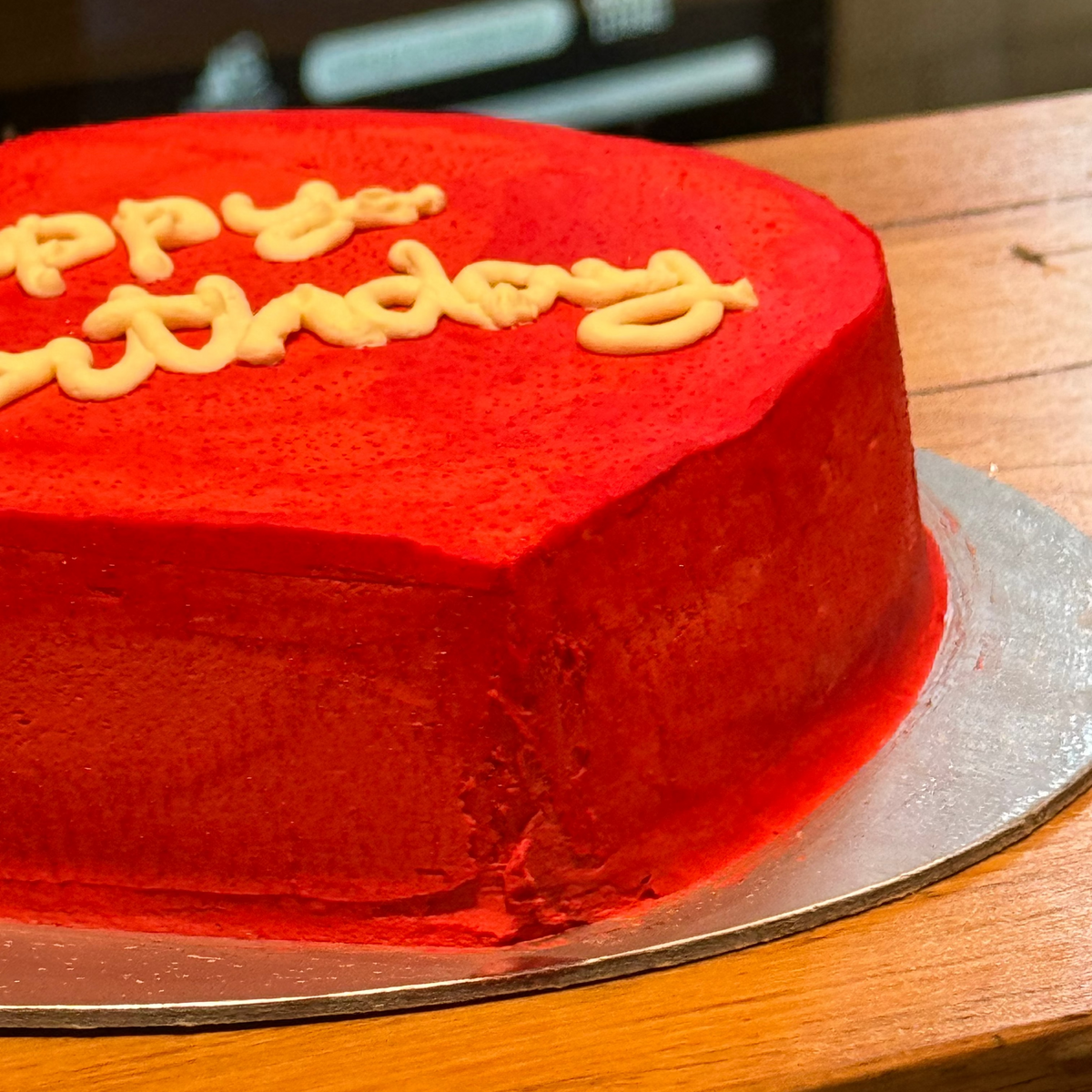Close-up of the romantic decorative finish on a Valentine's heart cake handcrafted in Adelaide using Ben & Jerry's ice cream.