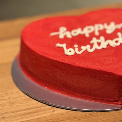 Side view of a handcrafted Valentine's Day heart-shaped cake made with Ben & Jerry's ice cream in Adelaide, highlighting its celebration-ready presentation.