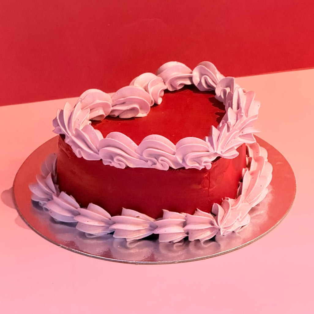 side view of a vintage heart cake made with Ben & Jerry's ice cream in Adelaide, showcasing its layered contrast piping and retro styling.