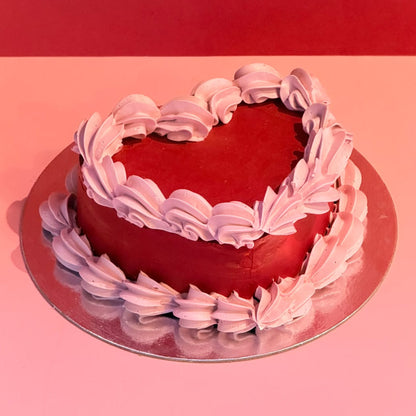 Full view of a vintage heart-shaped cake with contrasting decorative piping, handcrafted in Adelaide using Ben & Jerry's ice cream.