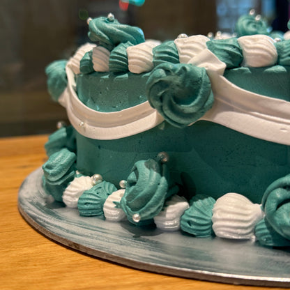 close up of a handcrafted vintage heart ice cream cake in Adelaide made using Ben & Jerry's ice cream, highlighting its decorative piping.