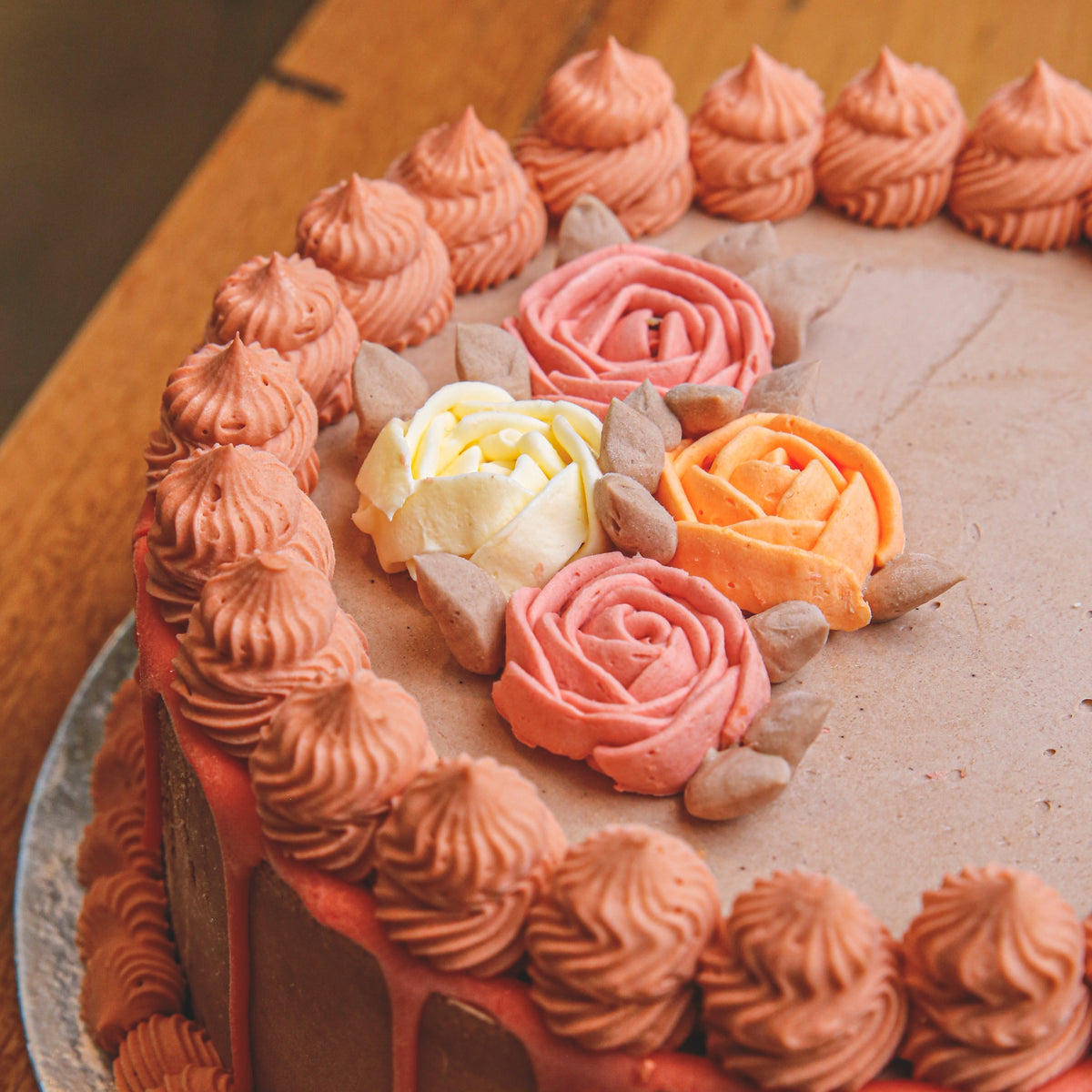Close-up view of a roses birthday cake highlighting the detailed rose decorations and delicate floral-inspired finishing touches.